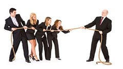 Workers pulling a rope in front their boss.jpg