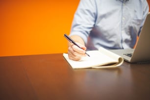 scenario-planning-man-with-laptop-pen-notepad