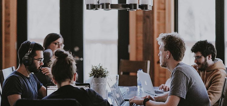 people sitting around a table discussing